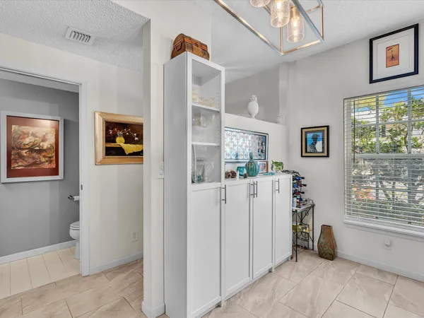 a view of kitchen with furniture and windows