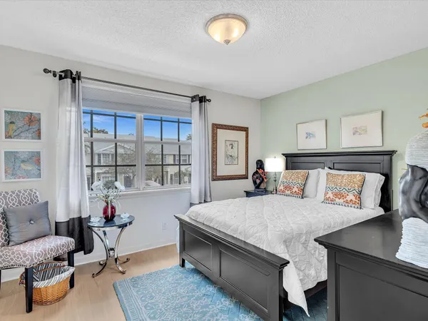 a bedroom with a bed and a table in it