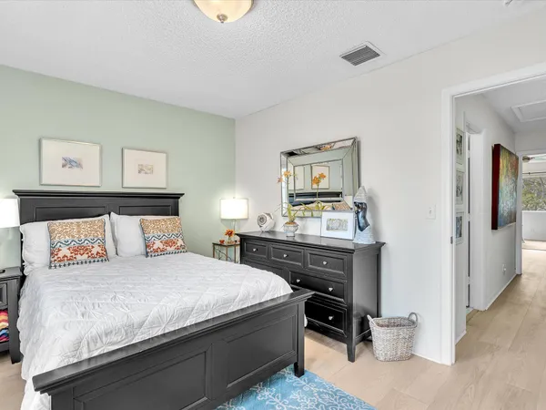 a bedroom with a bed and a table in it