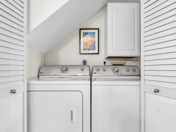 a utility room with dryer and washer