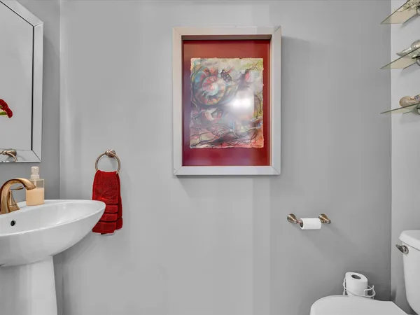 a bathroom with a toilet and a sink