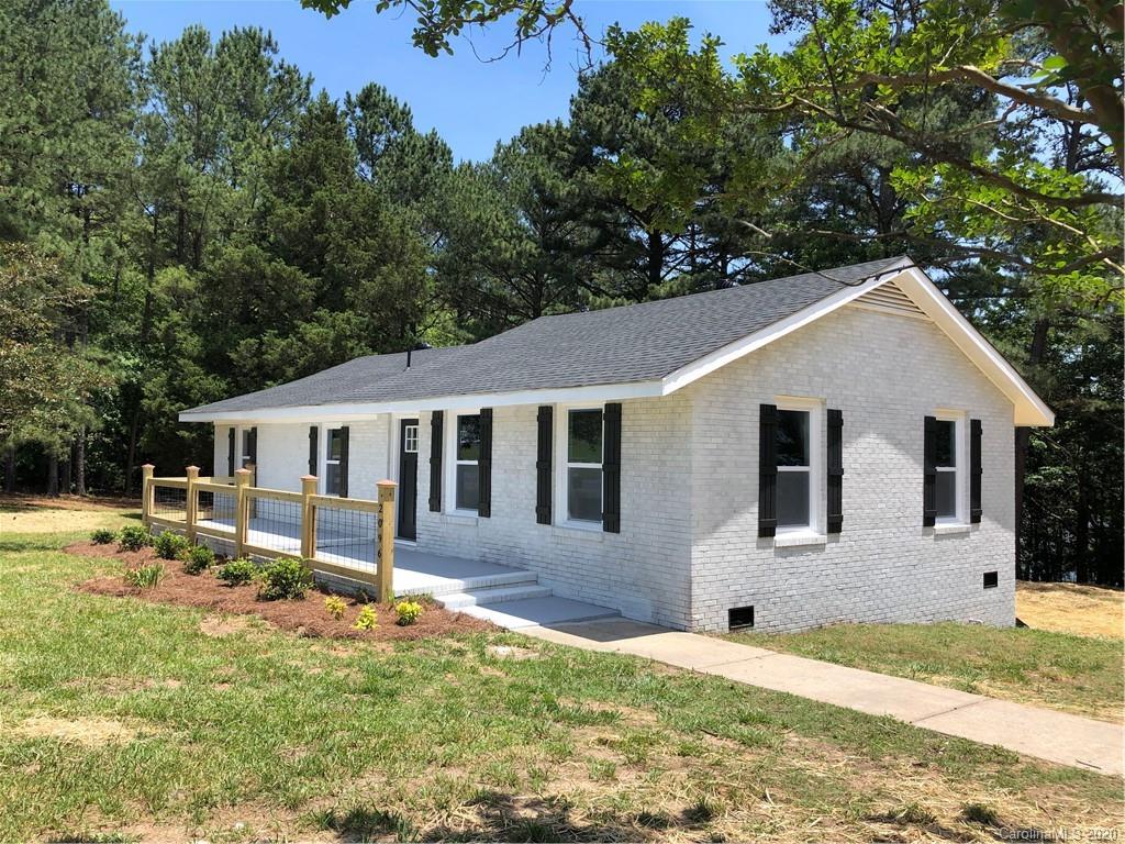 2096 Hardin Strait Road Chester, SC 29706 - Photo 1 of 27 a front view of a house with a yard and trees