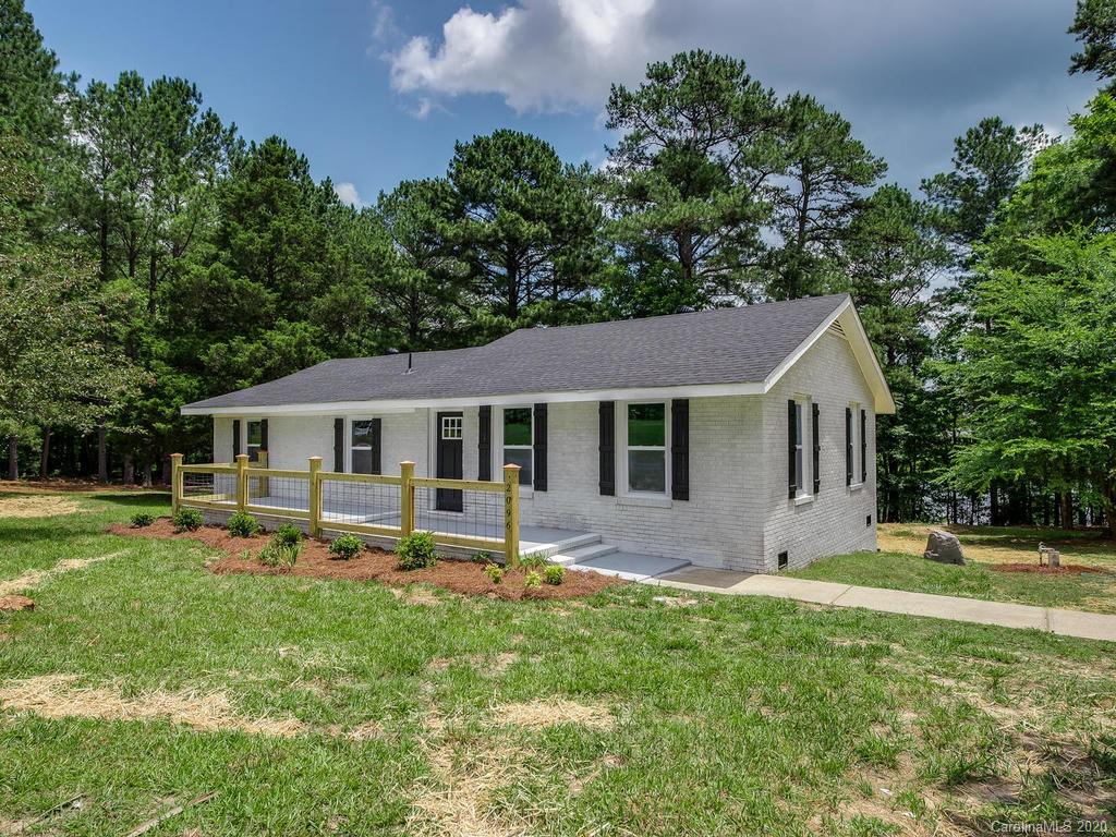 2096 Hardin Strait Road Chester, SC 29706 - Photo 2 of 27 a front view of house with a garden and trees