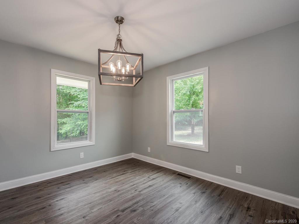 2096 Hardin Strait Road Chester, SC 29706 - Photo 11 of 27 wooden floor in an empty room with a window