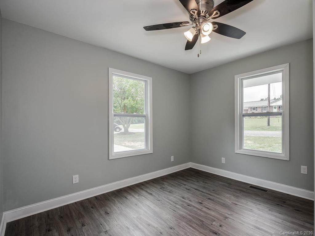 2096 Hardin Strait Road Chester, SC 29706 - Photo 12 of 27 wooden floor in an empty room with a window