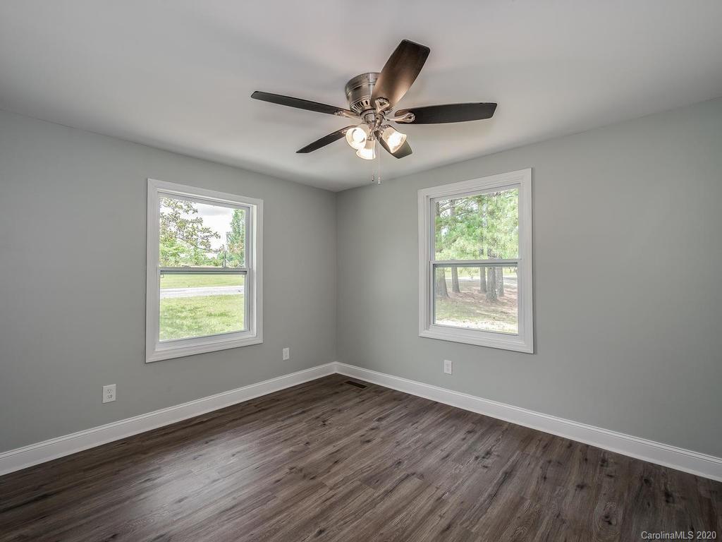 2096 Hardin Strait Road Chester, SC 29706 - Photo 15 of 27 a view of an empty room with wooden floor and a window