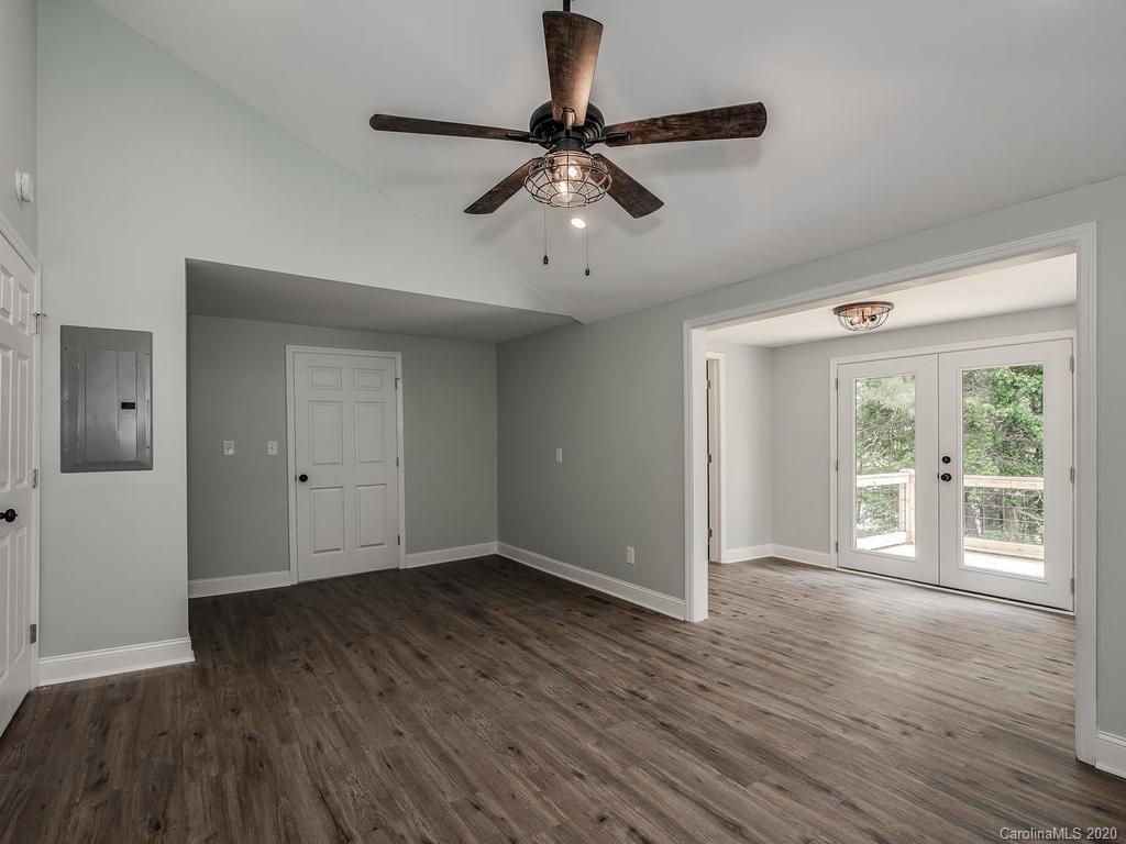 2096 Hardin Strait Road Chester, SC 29706 - Photo 17 of 27 a view of an empty room with wooden floor and a window