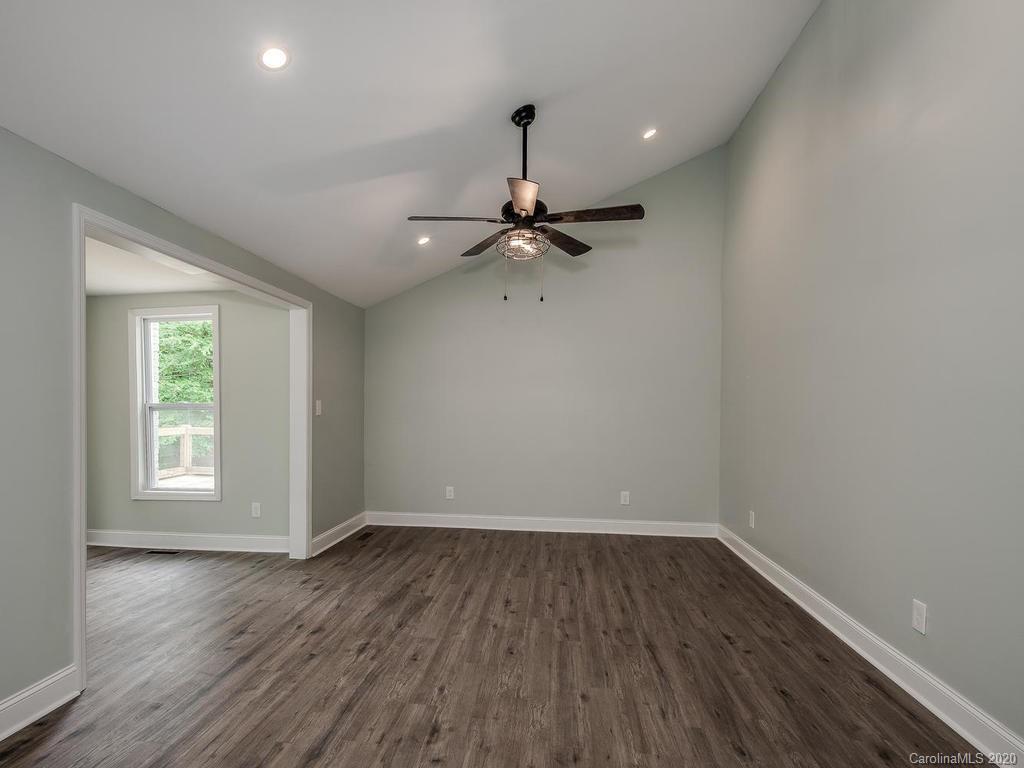 2096 Hardin Strait Road Chester, SC 29706 - Photo 18 of 27 a view of a room with wooden floor and a ceiling fan