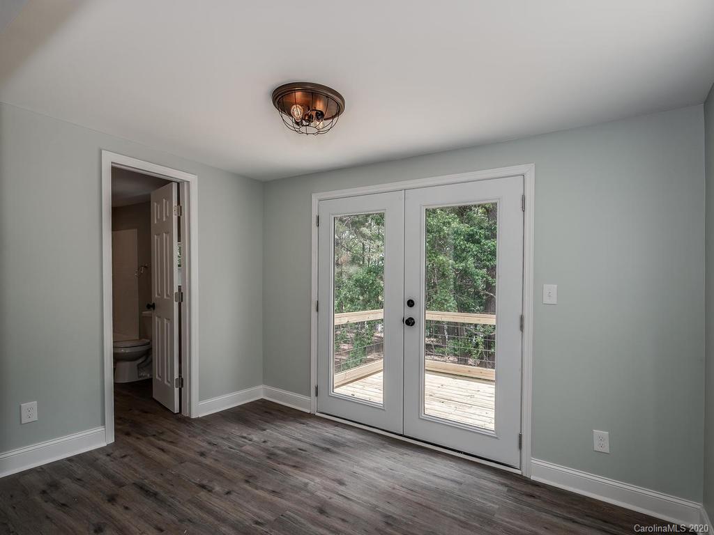 2096 Hardin Strait Road Chester, SC 29706 - Photo 19 of 27 a view of an empty room with wooden floor and a window