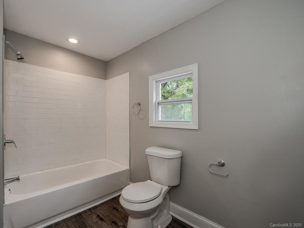 2096 Hardin Strait Road Chester, SC 29706 - Photo 21 of 27 a white toilet sitting next to a bath tub