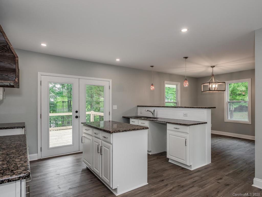 2096 Hardin Strait Road Chester, SC 29706 - Photo 8 of 27 a kitchen with a sink stove and wooden floor
