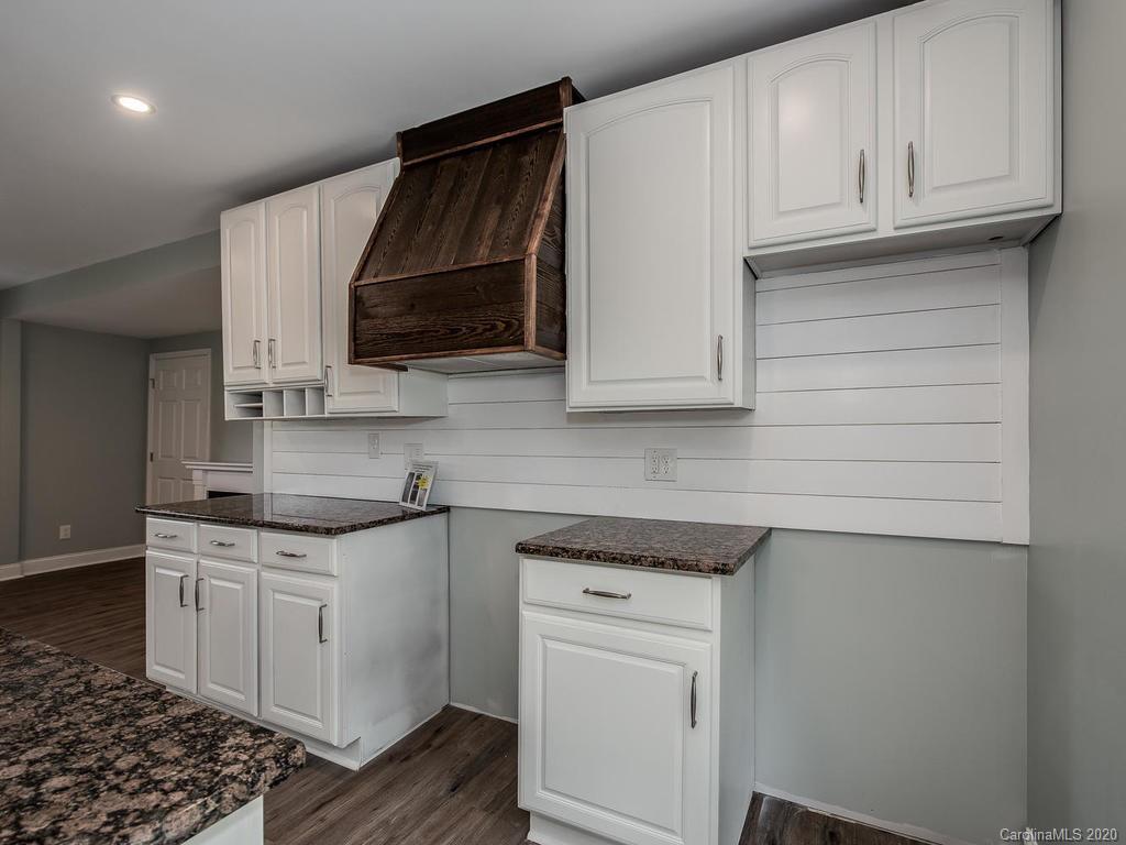 2096 Hardin Strait Road Chester, SC 29706 - Photo 9 of 27 a kitchen with stainless steel appliances granite countertop a sink and a stove