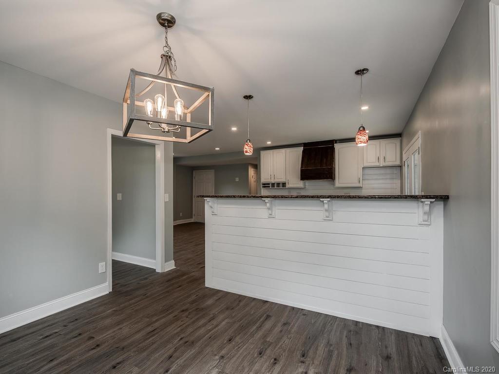 2096 Hardin Strait Road Chester, SC 29706 - Photo 10 of 27 a view of a kitchen with stainless steel appliances kitchen island a large island in the center