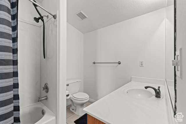 1099 Three Point Avenue Logan, UT 84321 - Photo 12 of 27 Bathroom featuring vanity, tile patterned floors, shower / tub combo with curtain, and a textured ceiling