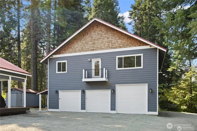 a view of a house with a yard and garage