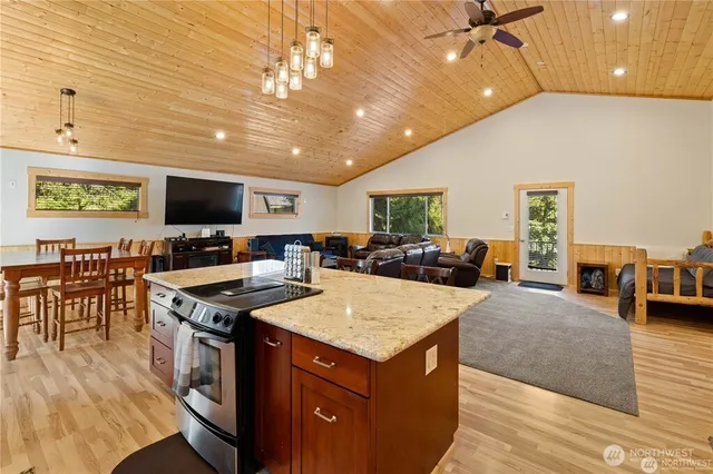 a view of kitchen with cabinets appliances and wooden floor