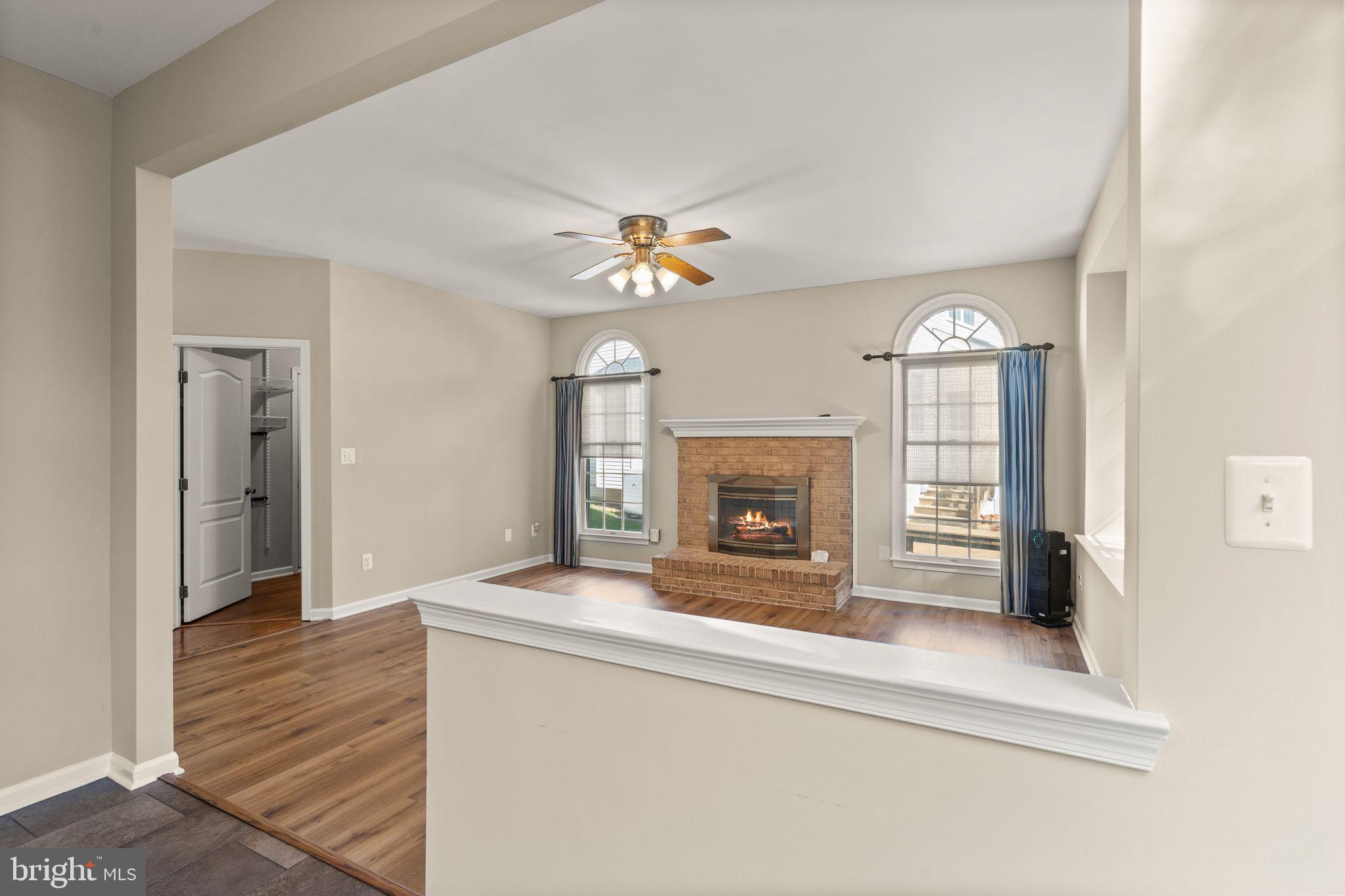 1327 Murray Downs Way Reston, VA 20194 - Photo 16 of 66 an empty room with fireplace and windows