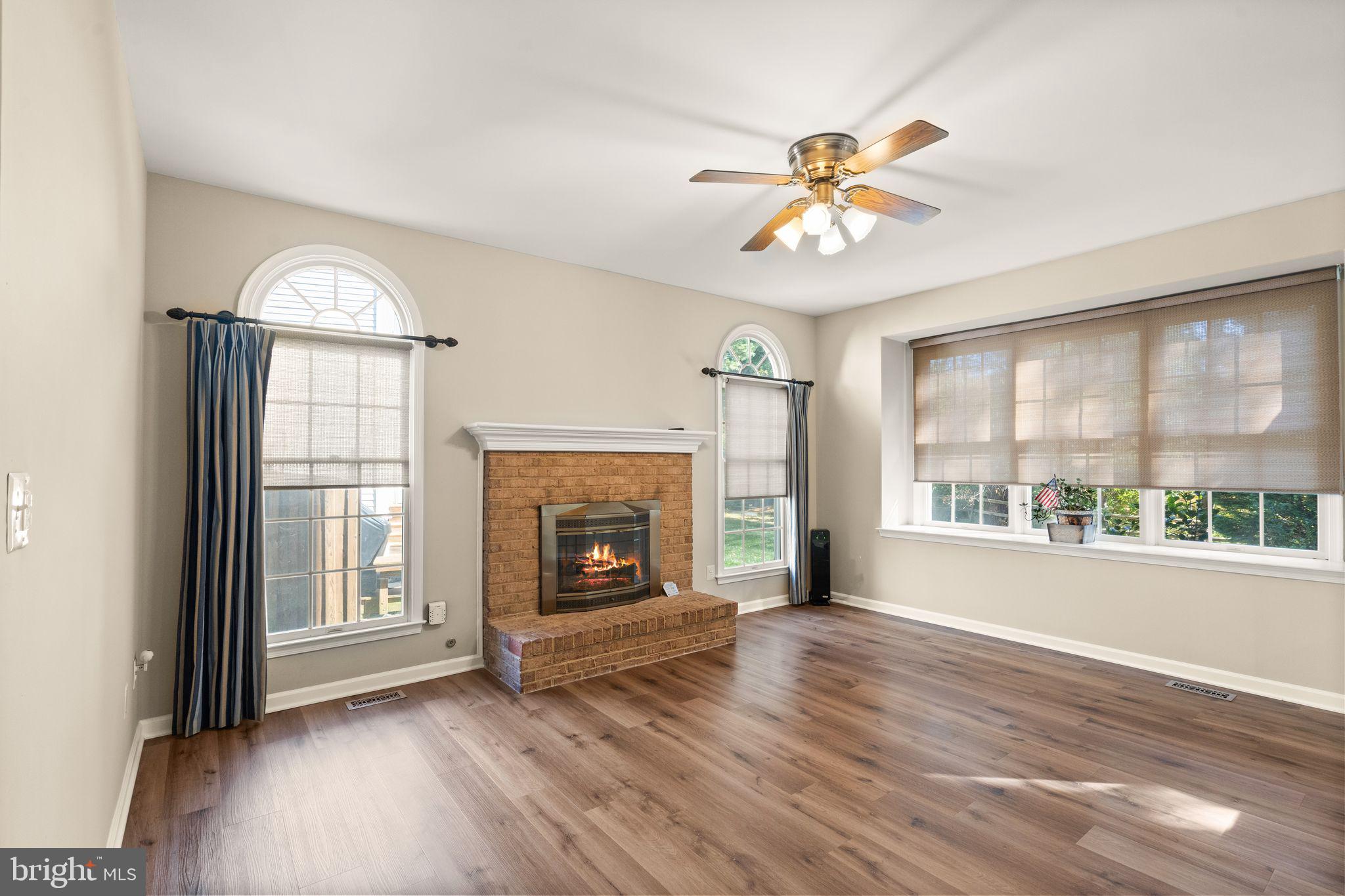 1327 Murray Downs Way Reston, VA 20194 - Photo 17 of 66 an empty room with wooden floor fan and windows