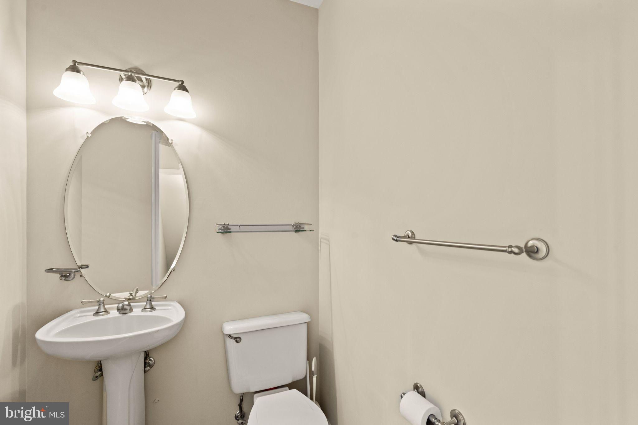 1327 Murray Downs Way Reston, VA 20194 - Photo 19 of 66 a bathroom with a sink mirror and toilet