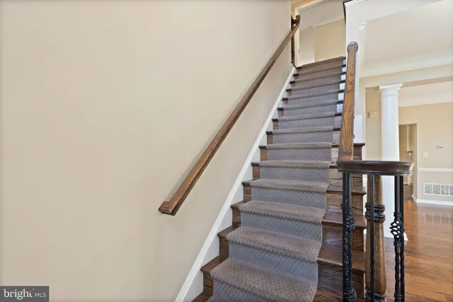 a view of a hallway view with staircase