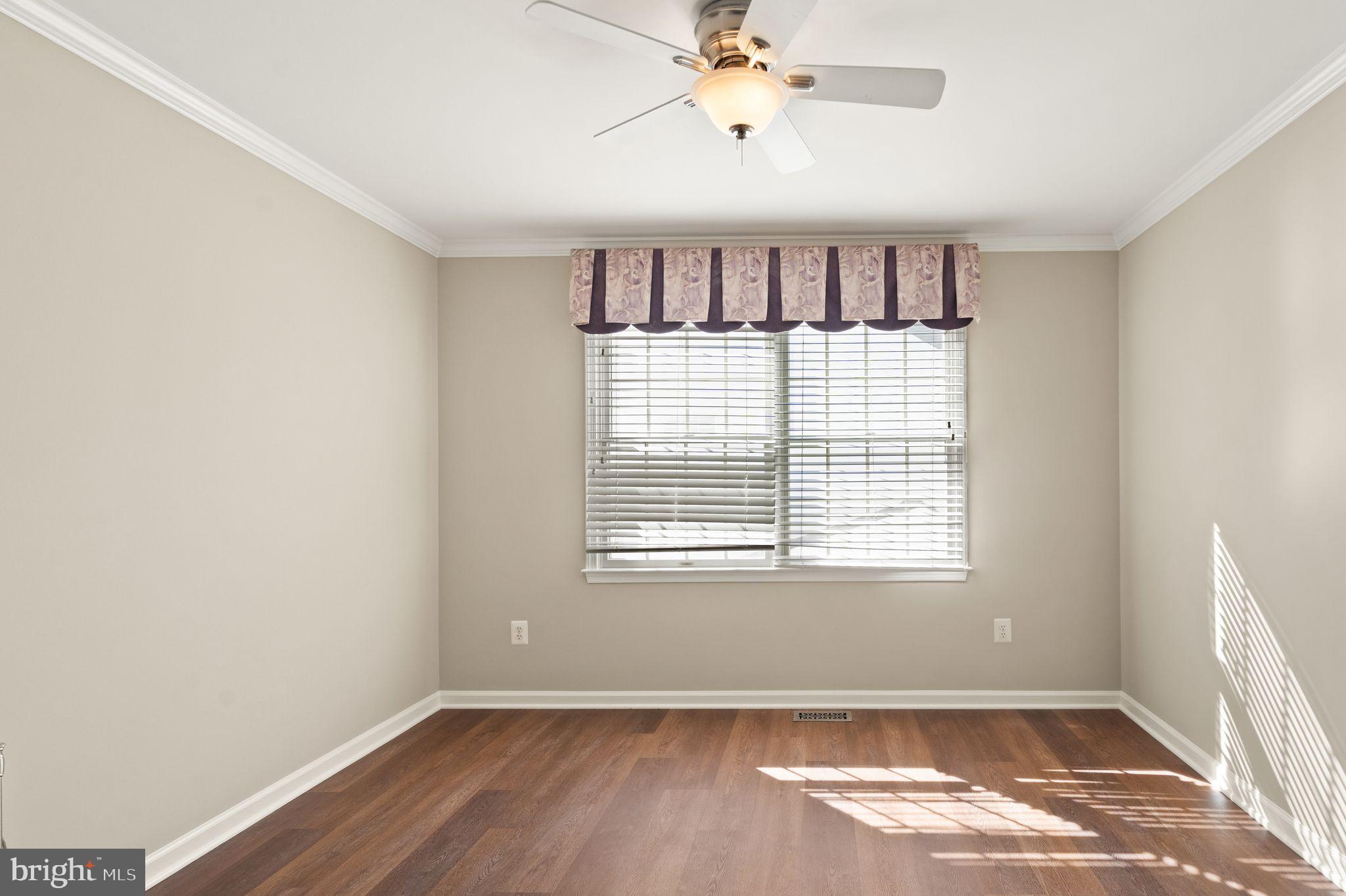1327 Murray Downs Way Reston, VA 20194 - Photo 24 of 66 a view of an empty room with a window and wooden floor