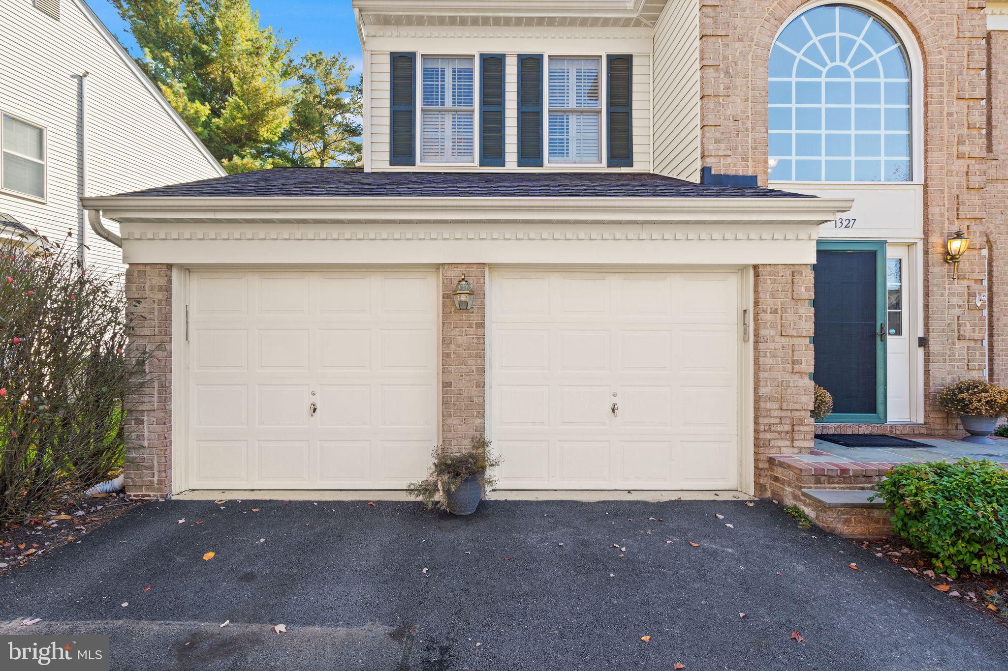 1327 Murray Downs Way Reston, VA 20194 - Photo 4 of 66 a front view of a house with a garage