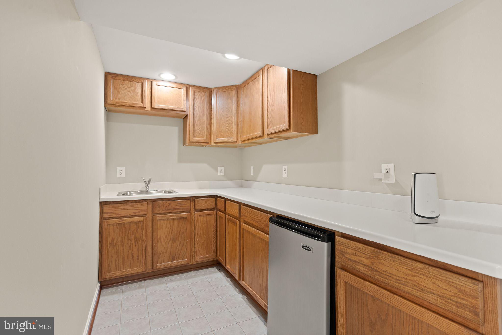 1327 Murray Downs Way Reston, VA 20194 - Photo 47 of 66 a kitchen with sink cabinets and window