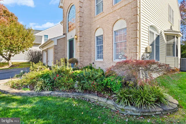 a view of an entryway with wooden floor and door