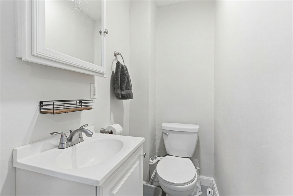 13 Knowlton Street Boston, MA 02127 - Photo 11 of 35 a bathroom with a toilet sink and mirror