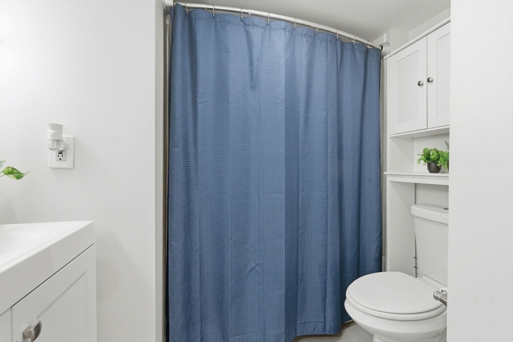 13 Knowlton Street Boston, MA 02127 - Photo 13 of 35 a bathroom with a sink a toilet and shower