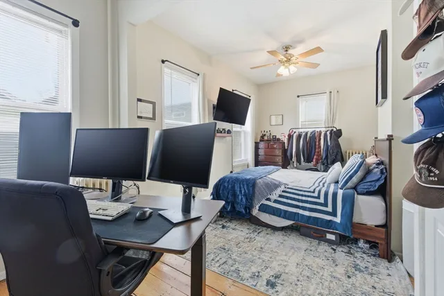 a workspace with furniture and a flat screen tv