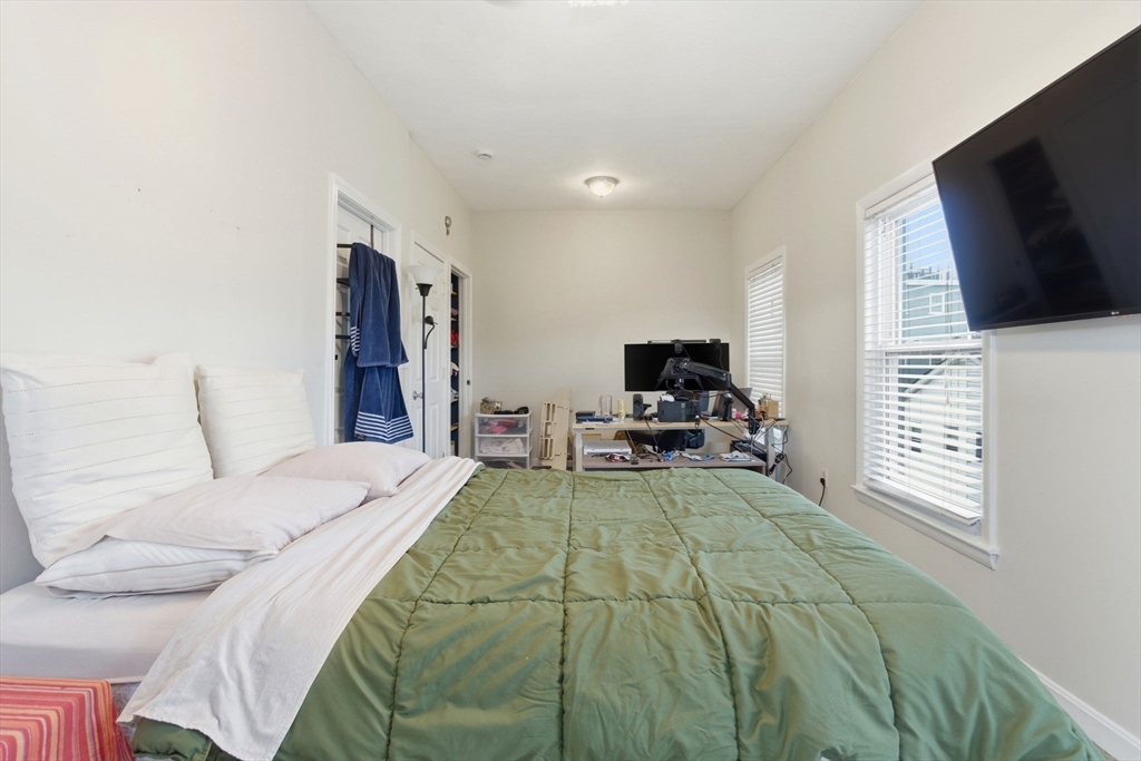 13 Knowlton Street Boston, MA 02127 - Photo 6 of 35 a bedroom with a bed and a flat screen tv
