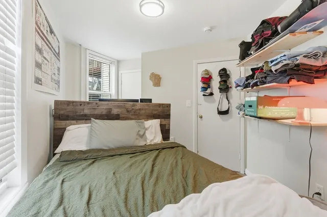 a room with a bed and furniture