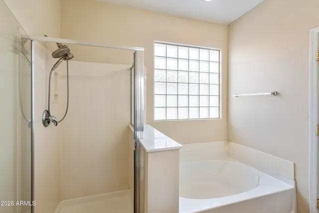 a bath tub sitting next to a window