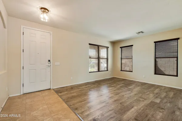 a view of an empty room with a window
