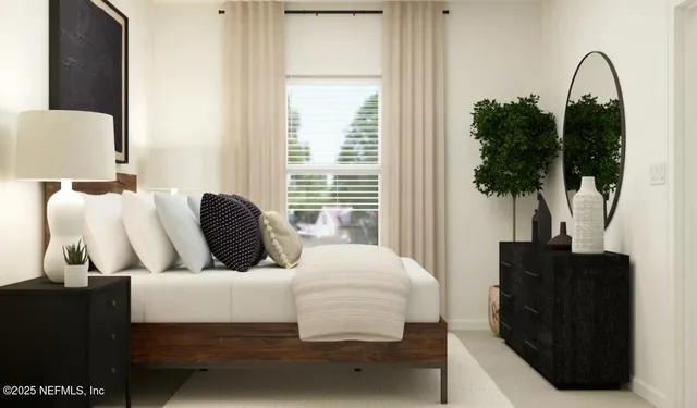 a bedroom with a large bed and a window