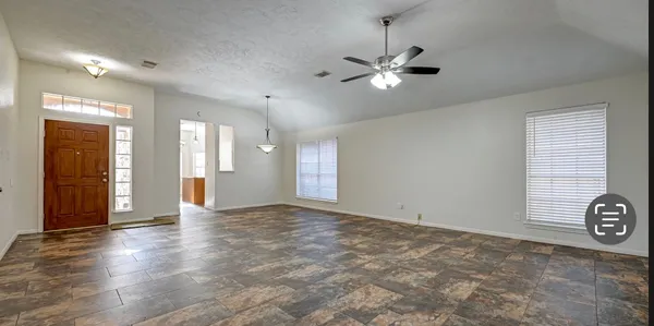 a view of an empty room with a window