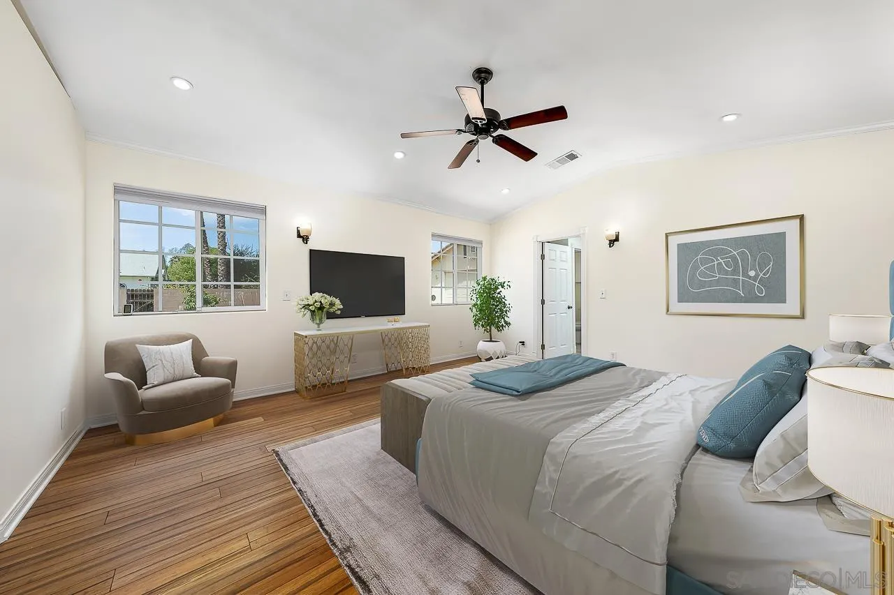 13610 Putney Road Poway, CA 92064 - Photo 15 of 62 a bedroom with a bed a couch and a flat screen tv