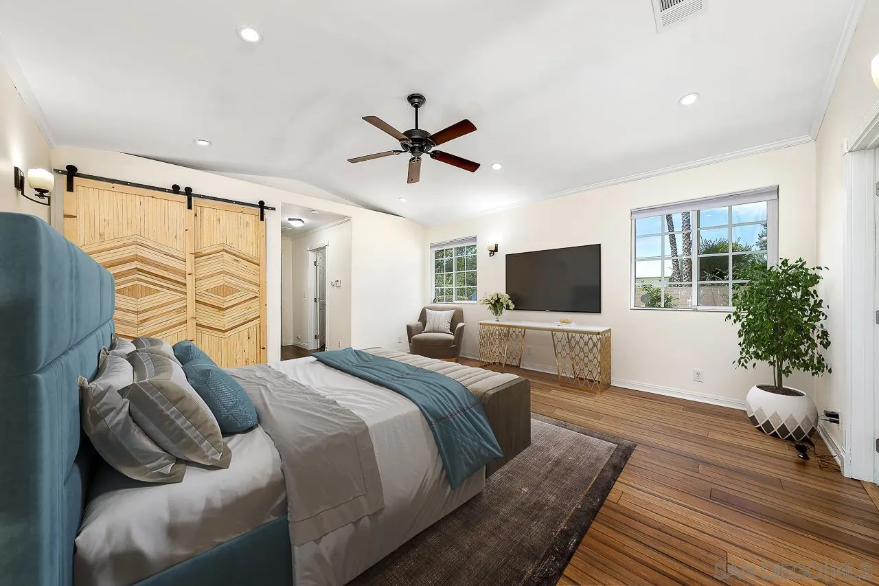 13610 Putney Road Poway, CA 92064 - Photo 16 of 62 a bedroom with a bed and flat screen tv