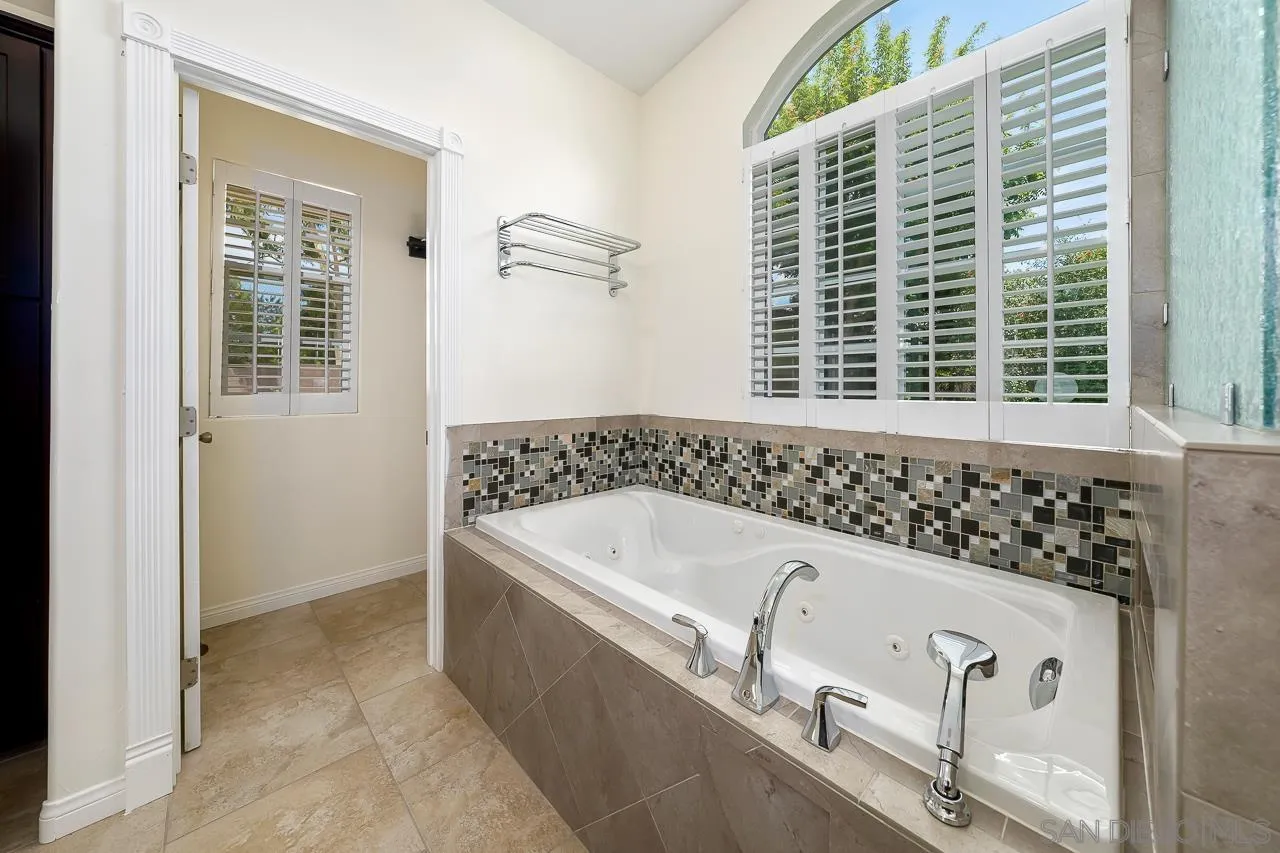 13610 Putney Road Poway, CA 92064 - Photo 18 of 62 a bath tub sitting in a bathroom next to a window