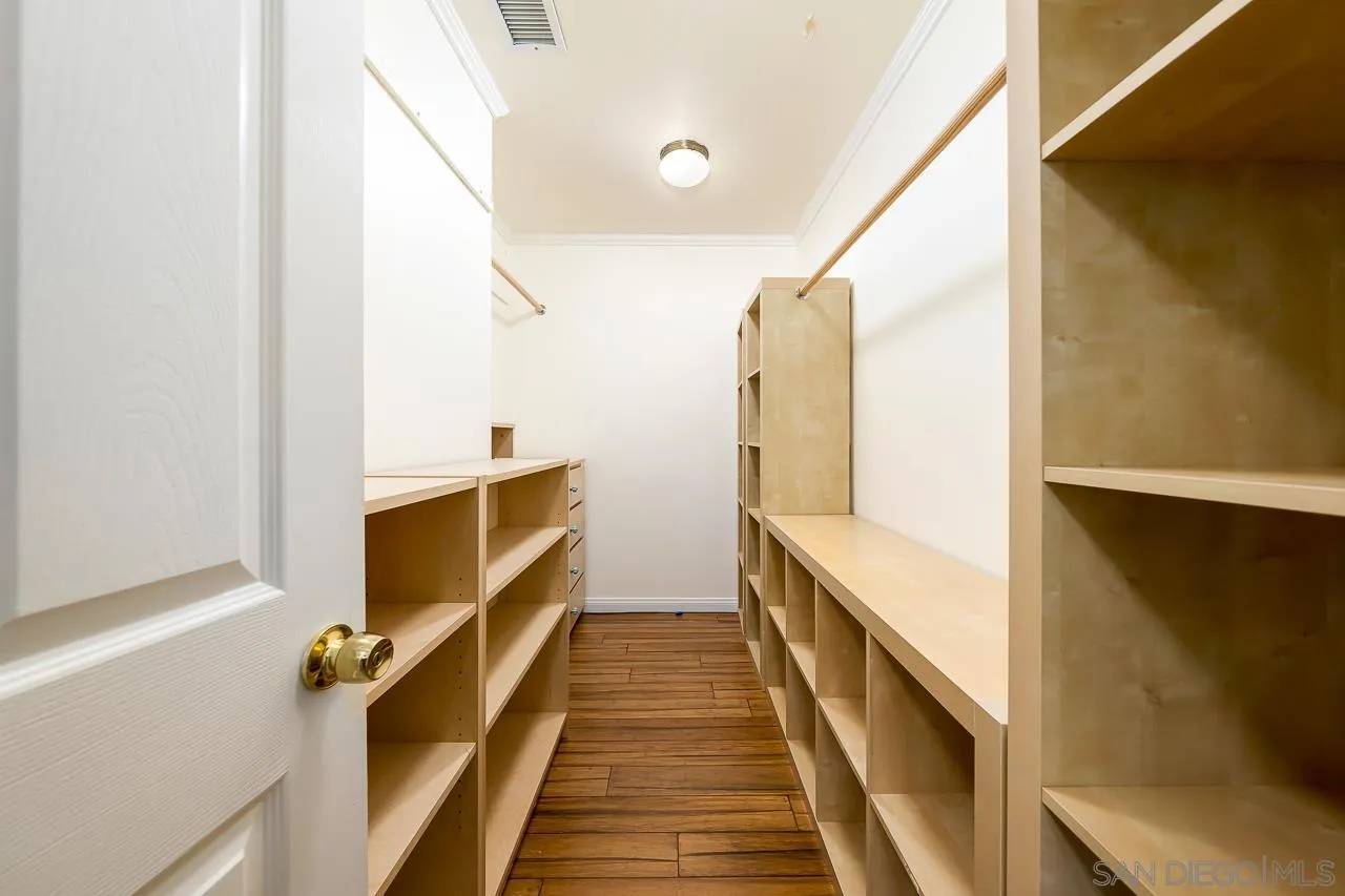 13610 Putney Road Poway, CA 92064 - Photo 22 of 62 a view of a hallway with wooden floor and staircase