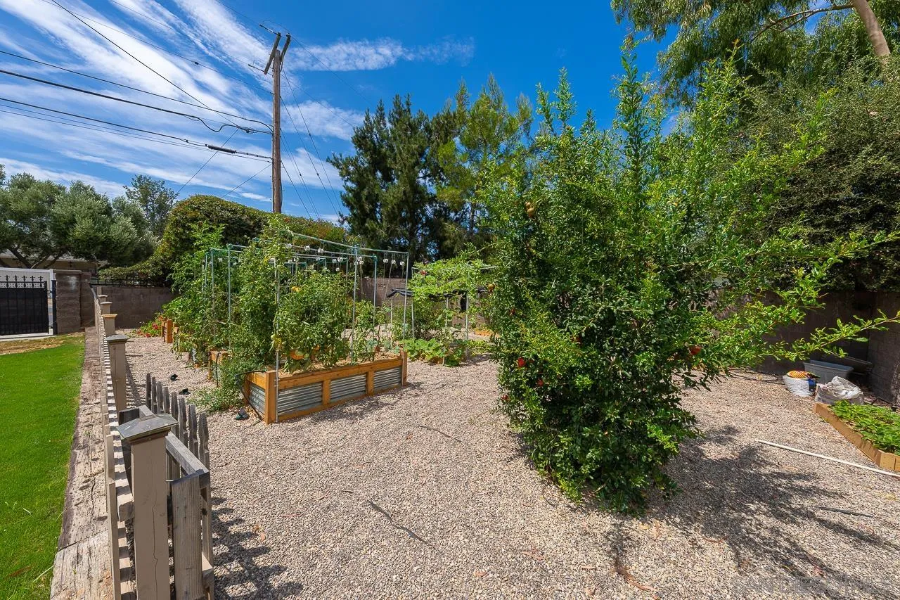 13610 Putney Road Poway, CA 92064 - Photo 34 of 62 a backyard of a house with outdoor seating and green space