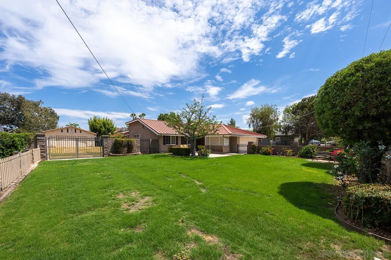 13610 Putney Road Poway, CA 92064 - Photo 43 of 62 a front view of a house with a yard