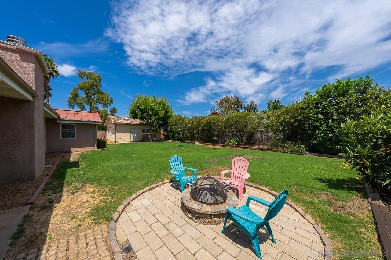 13610 Putney Road Poway, CA 92064 - Photo 47 of 62 a view of a chair and tables in the garden