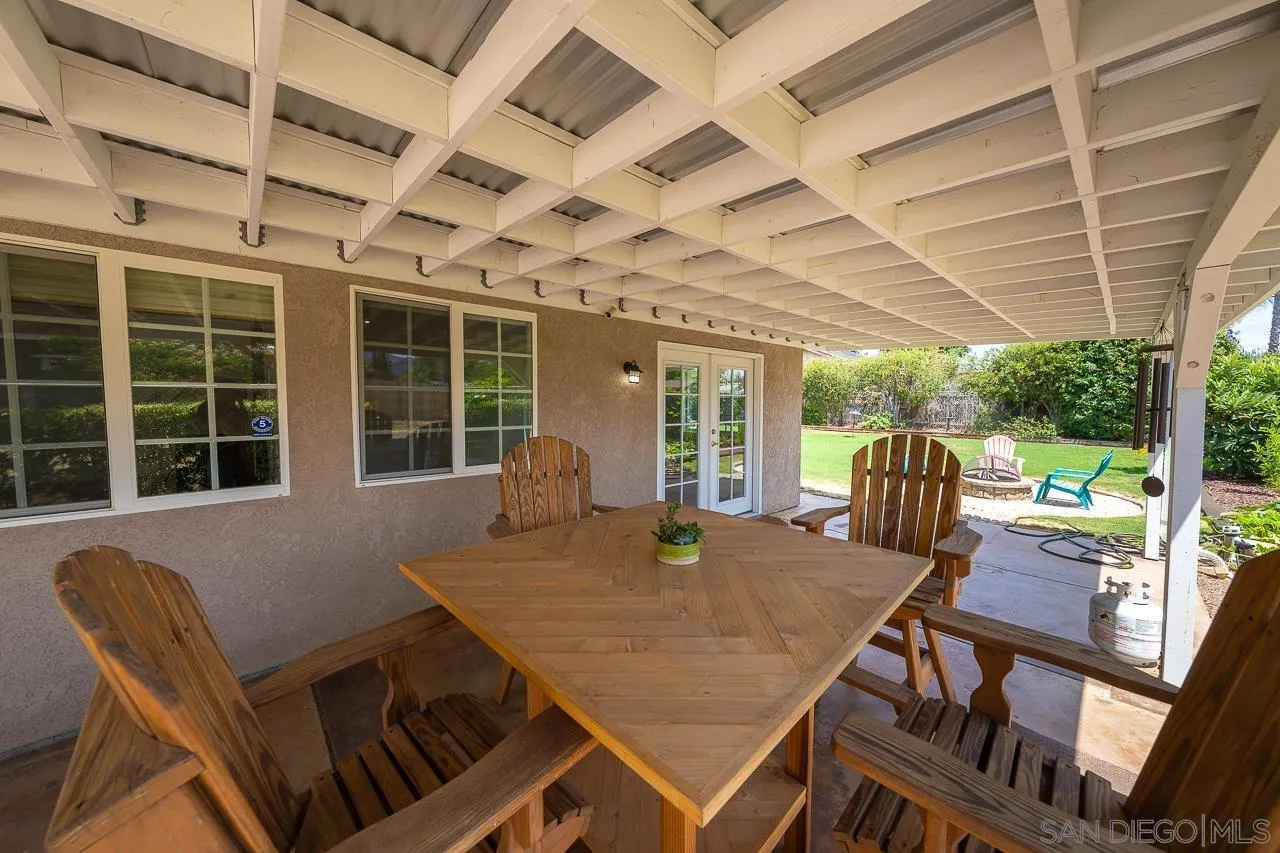 13610 Putney Road Poway, CA 92064 - Photo 52 of 62 a view of a patio with table and chairs