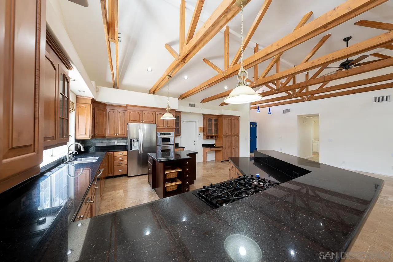 13610 Putney Road Poway, CA 92064 - Photo 8 of 62 a living room with lots of furniture and a chandelier