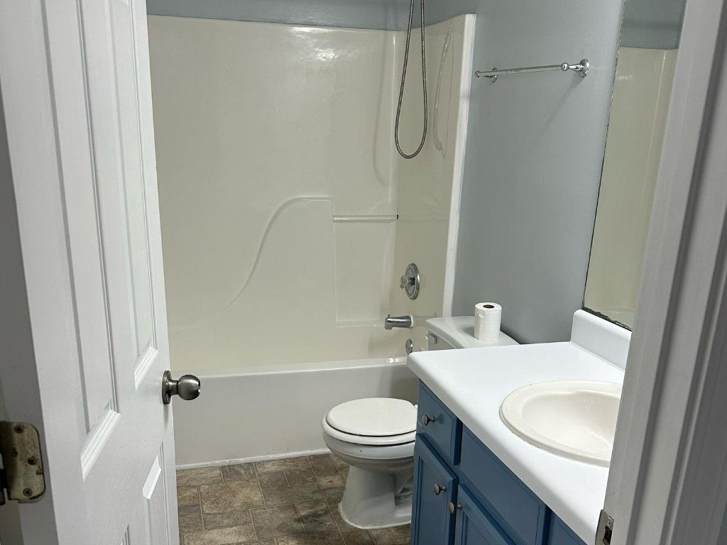 1261 Lakeview Road Grayson, GA 30017 - Photo 13 of 35 a bathroom with a sink a toilet and a shower