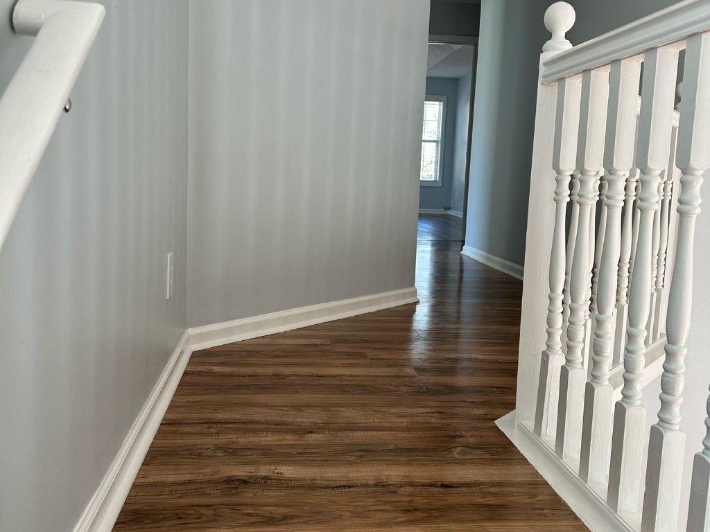 1261 Lakeview Road Grayson, GA 30017 - Photo 21 of 35 a view of wooden floor and staircase in a hall with wooden floor