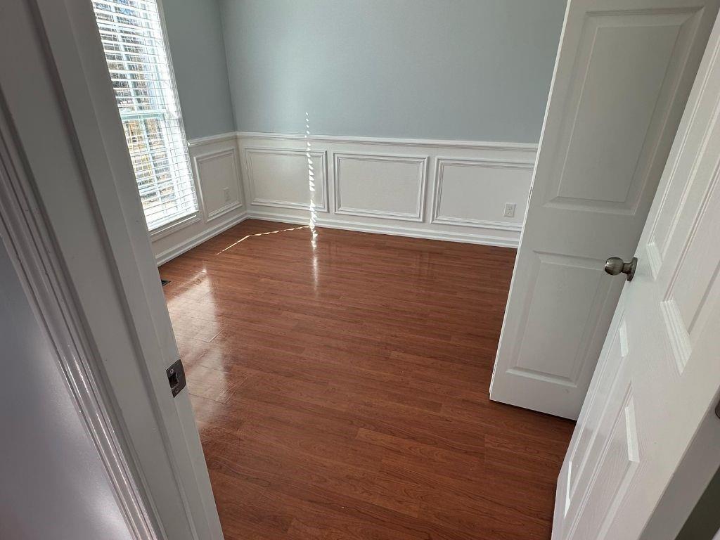 1261 Lakeview Road Grayson, GA 30017 - Photo 26 of 35 an empty room with wooden floor and windows
