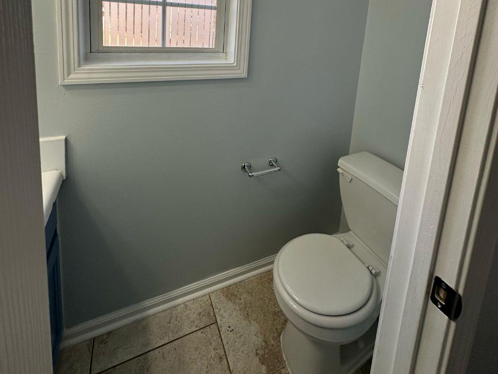 1261 Lakeview Road Grayson, GA 30017 - Photo 30 of 35 a white toilet sitting next to a window